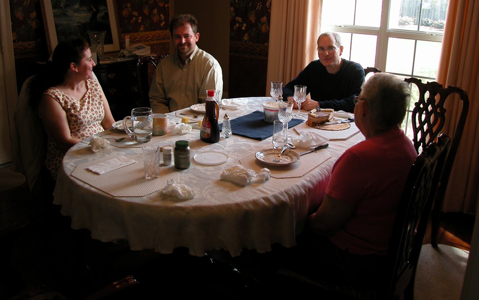 Jackie and Steve, Marc, and Mom about to celebrate Thanksgiving Dinner in Mom's Dining Room